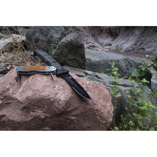 Forked knife on a rock with a natural outdoor background